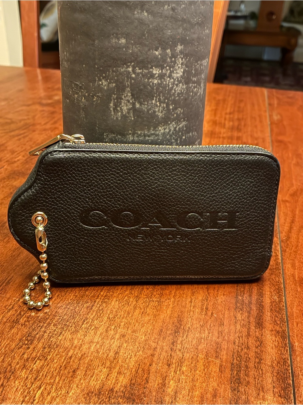 Coach Black Pebbled Leather Hang tag wallet.